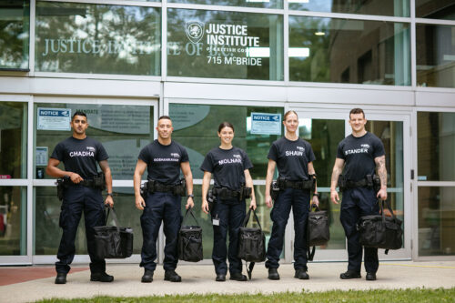 Five new constables stand outside the JIBC.